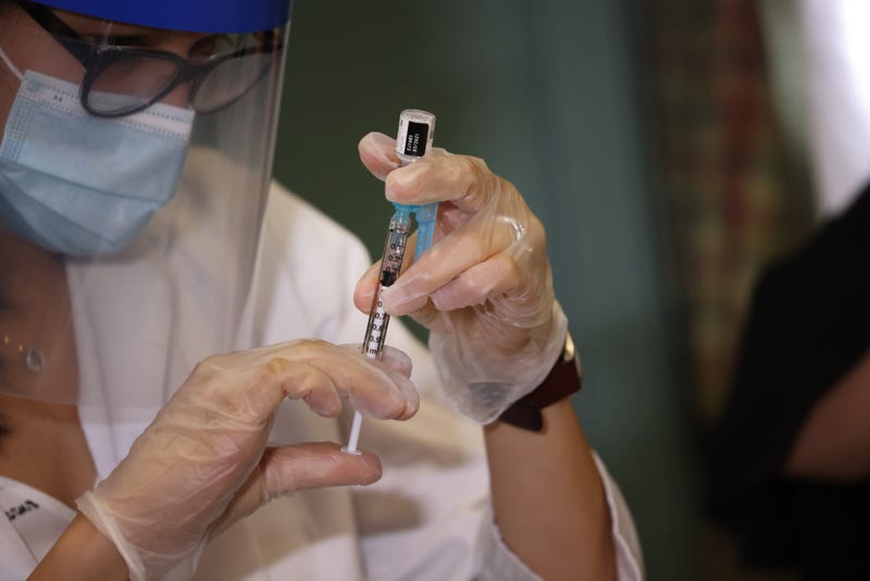 Walgreens pharmacist Jessica Sahni administers the Pfizer-BioNTech COVID-19 vaccine at the New Jewish Home in Manhattan on December 21, 2020 in New York City.