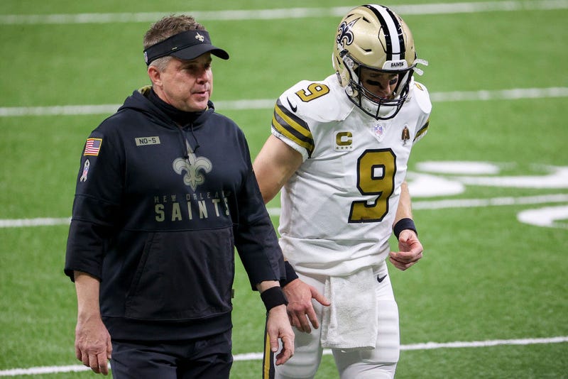 Sean Payton, left, and Drew Brees walk down the field together.