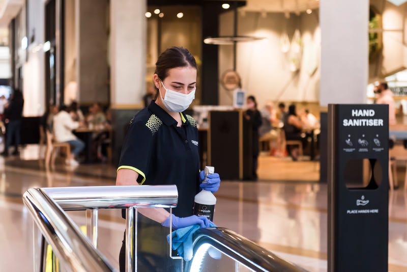 An employee cleans surfaces during the Boxing Day sales at Chadstone the Fashion Capital on December 26, 2020 in Melbourne, Australia.