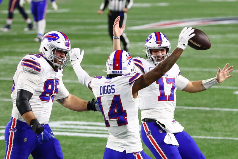 Stefon Diggs (14) celebrates a touchdown with Josh Allen (17) and Lee Smith.