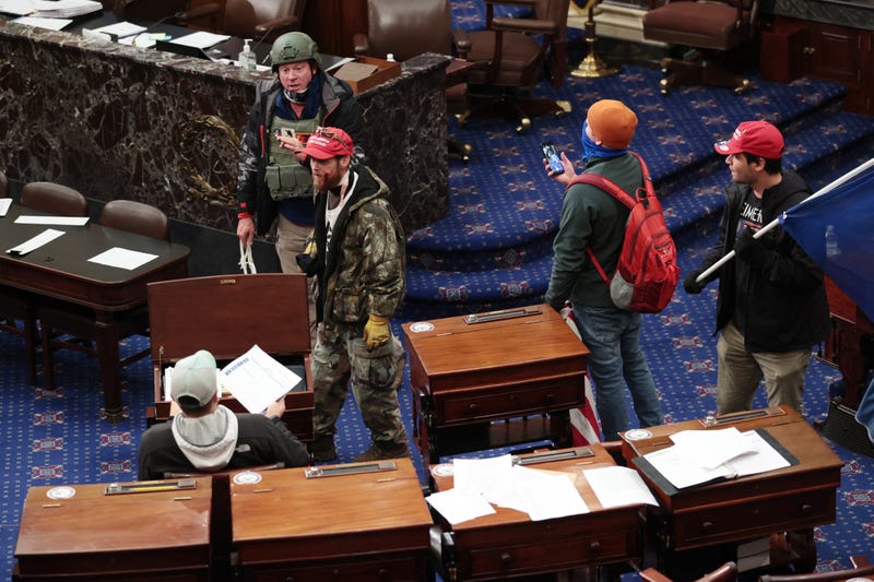Protesters enter the Senate Chamber on January 06, 2021 in Washington, DC. Congress held a joint session today to ratify President-elect Joe Biden's 306-232 Electoral College win over President Donald Trump. Pro-Trump protesters have entered the U.S. Capitol building after mass demonstrations in the nation's capital.