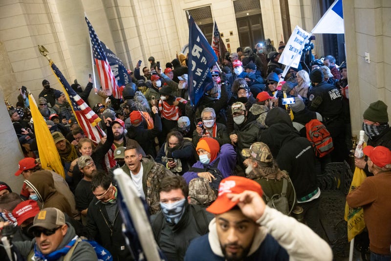 Protesters supporting U.S. President Donald Trump gather near the east front door of the U.S. Capitol after groups breached the building's security on January 06, 2021 in Washington, DC. Pro-Trump protesters entered the U.S. Capitol building during demonstrations in the nation's capital.