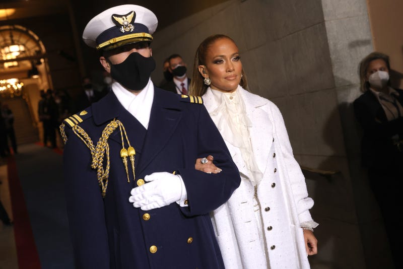Jennifer Lopez is escorted to the inauguration of U.S. President-elect Joe Biden on the West Front of the U.S. Capitol on January 20, 2021 in Washington, DC. During today's inauguration ceremony Joe Biden becomes the 46th president of the United States.