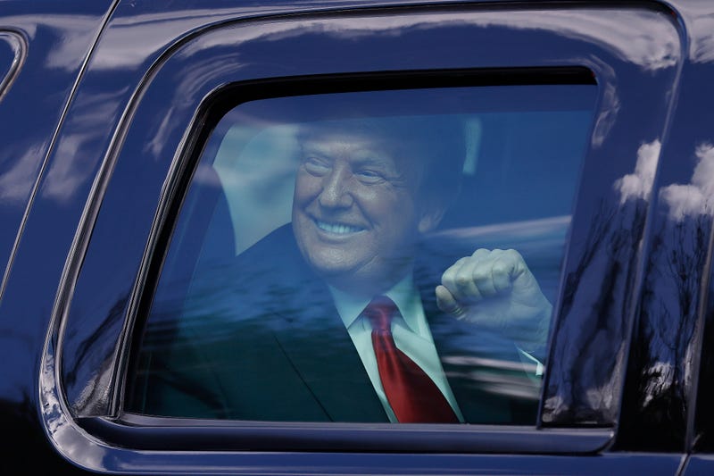 President Donald Trump waves to supporters in West Palm Beach, Florida.