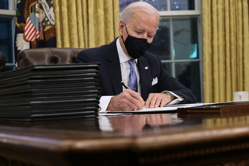 U.S. President Joe Biden prepares to sign a series of executive orders at the Resolute Desk in the Oval Office just hours after his inauguration on January 20, 2021 in Washington, DC. Biden became the 46th president of the United States earlier today during the ceremony at the U.S. Capitol.