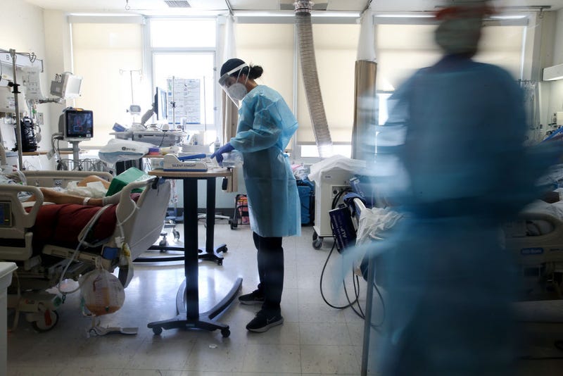 Registered nurse Alisha Thiebert (C) cares for COVID-19 patients in a makeshift ICU (Intensive Care Unit) at Harbor-UCLA Medical Center.
