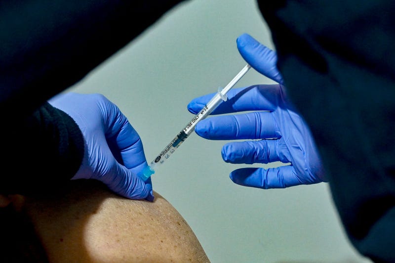 A woman receives a dose of Moderna COVID-19 vaccine at the vaccination mega center on February 15, 2021 in Athens, Greece.