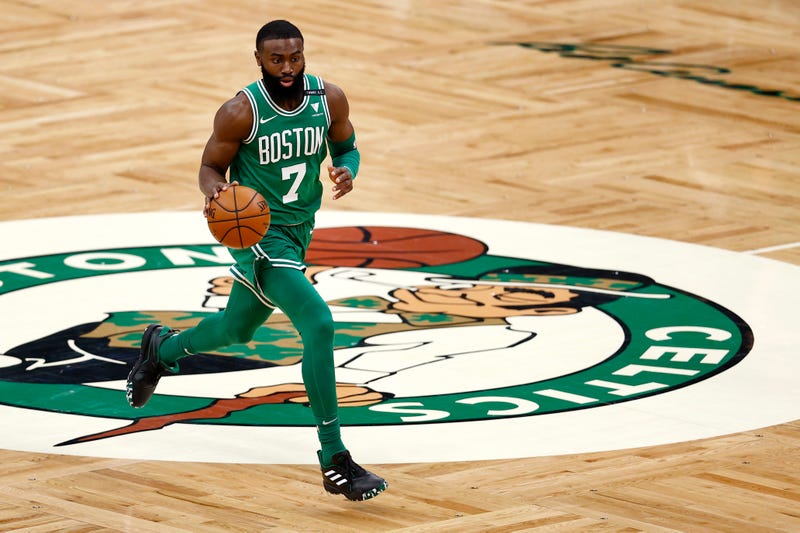 Celtics guard Jaylen Brown dribbling up the court.