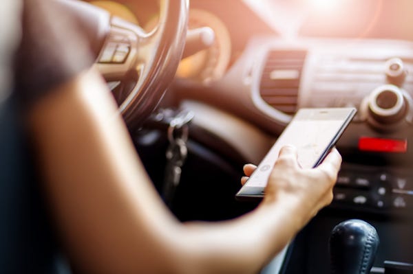 Woman texting while driving