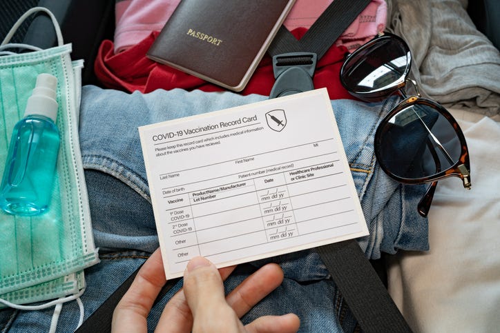 Vaccine card in a suitcase. 