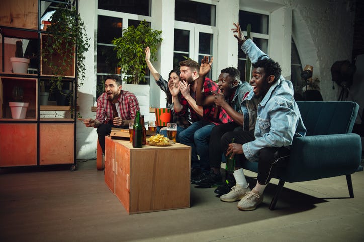 friends watching sports in home