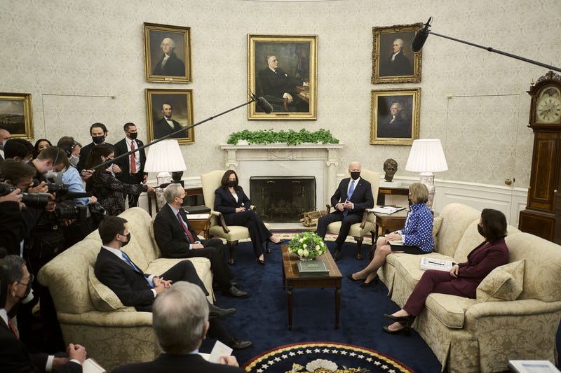 President Biden and Cabinet Members meet with Senators in the Oval Office.