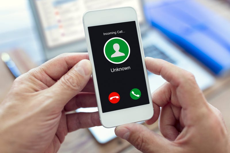 Unknown caller alert on phone stock image.