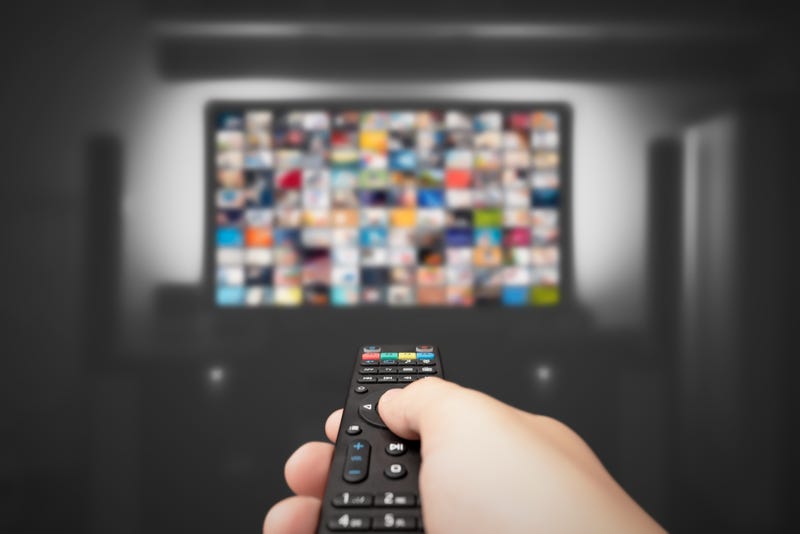 Hand holding remote control