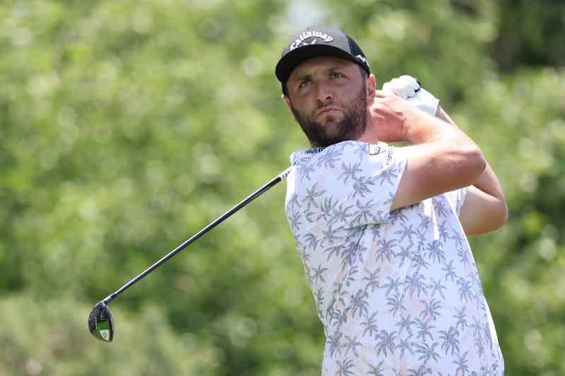 PGA Tour player Jon Rahm tees off.