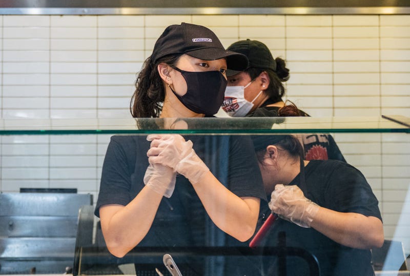 Employees are shown working at a Chipotle Mexican Grill on June 09, 2021 in Houston, Texas.
