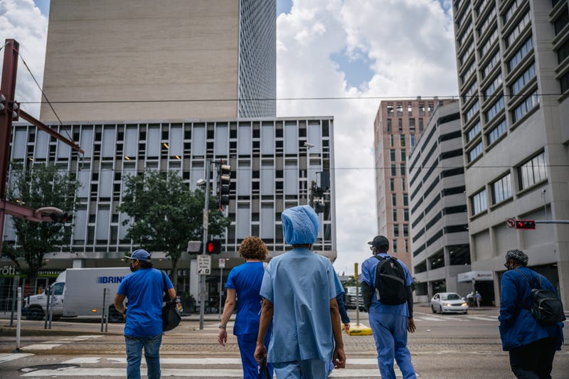 Medical workers outside Houston Methodist Hospital.
