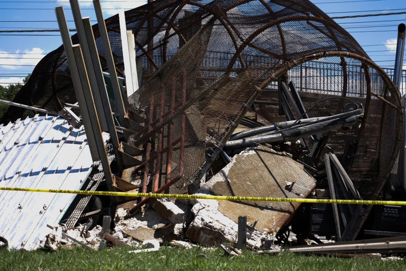 Debris is seen after a pedestrian bridge collapsed on June 23, 2021 in Washington, DC. At least six people were reportedly injured on Wednesday when a pedestrian bridge collapsed onto DC-295 and trapped a truck containing 500 pounds of diesel fuel. (Photo by Anna Moneymaker/Getty Images)
