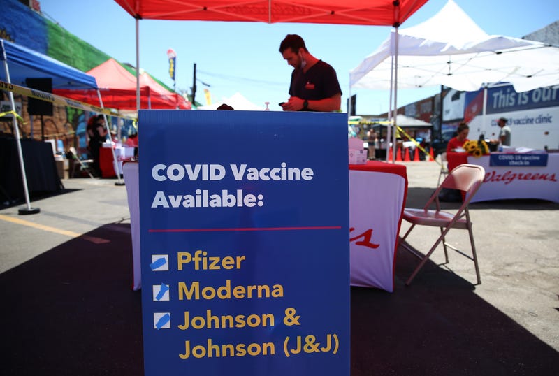 A sign displays the types of COVID-19 vaccination doses available at a Walgreens mobile bus clinic on June 25, 2021 in Los Angeles, California.
