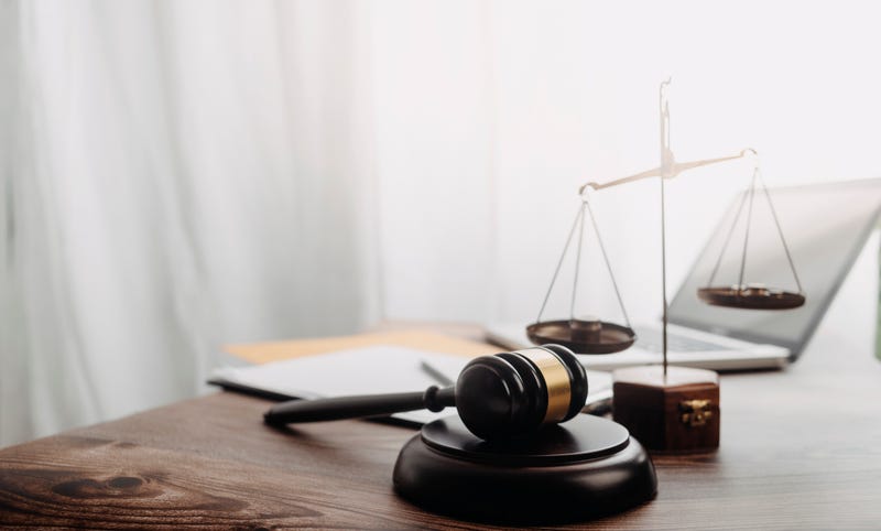 Gavel and scale representing law and order.