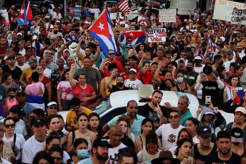 Protesters gather in front of the Versailles restaurant to show support for the people in Cuba who have taken to the streets there to protest on July 11, 2021 in Miami, Florida. Thousands of Cubans took to the streets across the country to protest pandemic restrictions, the pace of Covid-19 vaccinations and the Cuban government.