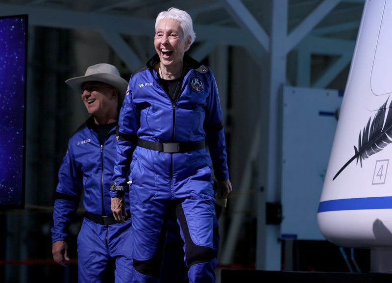 Blue Origin’s New Shepard crew (L-R) Jeff Bezos and Wally Funk arrive for a press conference after flying into space in the Blue Origin New Shepard rocket on July 20, 2021 in Van Horn, Texas.