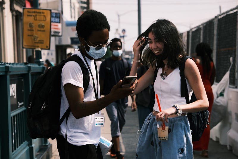 Members of the Test and Trace Corps walk the streets of Brooklyn passing out masks and trying to sign people up for the COVID-19 vaccine on July 26, 2021 in the Brooklyn borough of New York City. Due to the rapidly spreading Delta variant, New York City Mayor Bill de Blasio has announced that the city will require all city workers to be vaccinated or tested weekly for COVID-19. Currently, about 54 percent of New Yorkers have taken the vaccine.