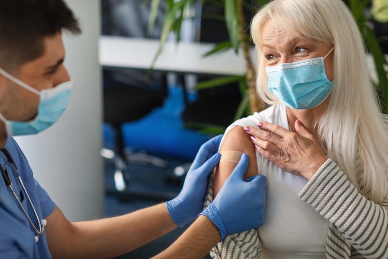 Senior getting vaccinated stock photo.