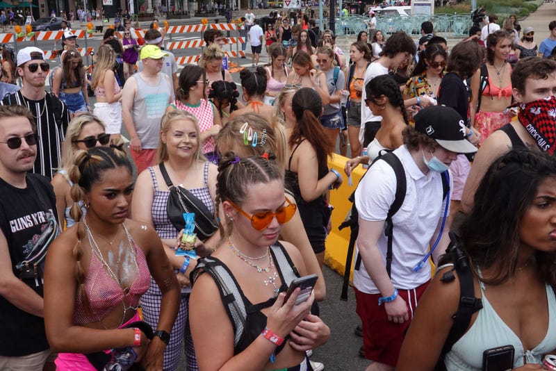 Guests arrive for the first day of the Lollapalooza music festival on July 29, 2021 in Chicago, Illinois. The four-day music festival in the city's downtown is expected to draw 110,000 fans each day.
