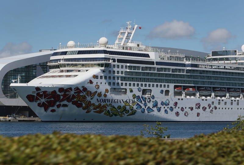 The Norwegian Gem, a cruise ship owned by Norwegian Cruise Line Holdings, is moored at PortMiami on August 09, 2021 in Miami, Florida. A federal judge sided with Norwegian Cruise Line Holdings, ruling that the company could require proof of vaccination from passengers before they boarded a cruise ship in Florida. The judge granted the preliminary injunction against the law that Florida Gov. Ron DeSantis signed earlier in the year that banned vaccine passports. (Photo by Joe Raedle/Getty Images)