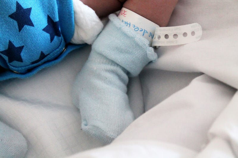baby foot wrapped in a sock