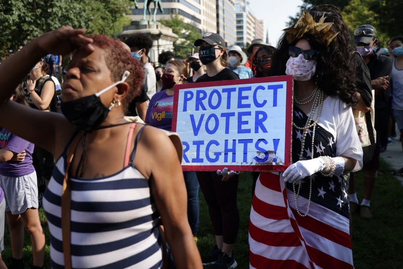 Voting rights activist Regina Cosio of Syracuse, New York, dresses as "Ms Liberty" as she participates in a pre-march rally during a March On For Voting Rights event at McPherson Square August 28, 2021 in Washington, DC. Activists gathered in Washington to mark the 58th anniversary of the 1963 March On Washington, where Dr. Martin Luther King delivered his “I Have a Dream” speech, and urged the Senate to pass voting rights legislations. (Photo by Alex Wong/Getty Images)