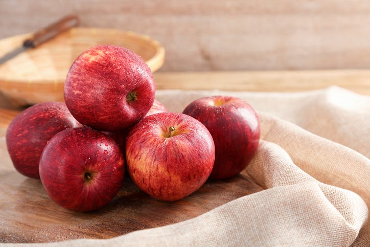 Group of Gala Apples on wooden board background