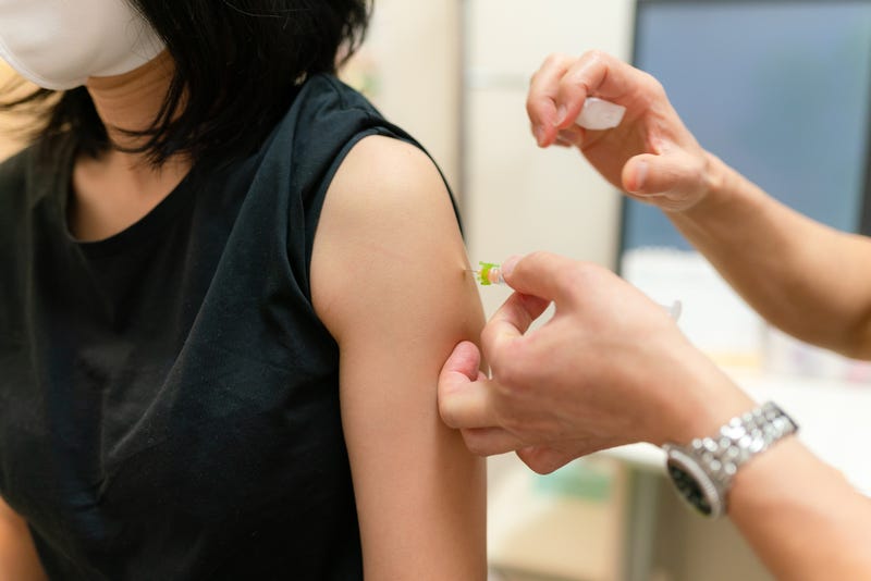 Woman getting injection stock photo.