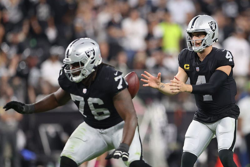 Quarterback Derek Carr #4 of the Las Vegas Raiders snaps the football during the NFL game at Allegiant Stadium on September 13, 2021 in Las Vegas, Nevada.