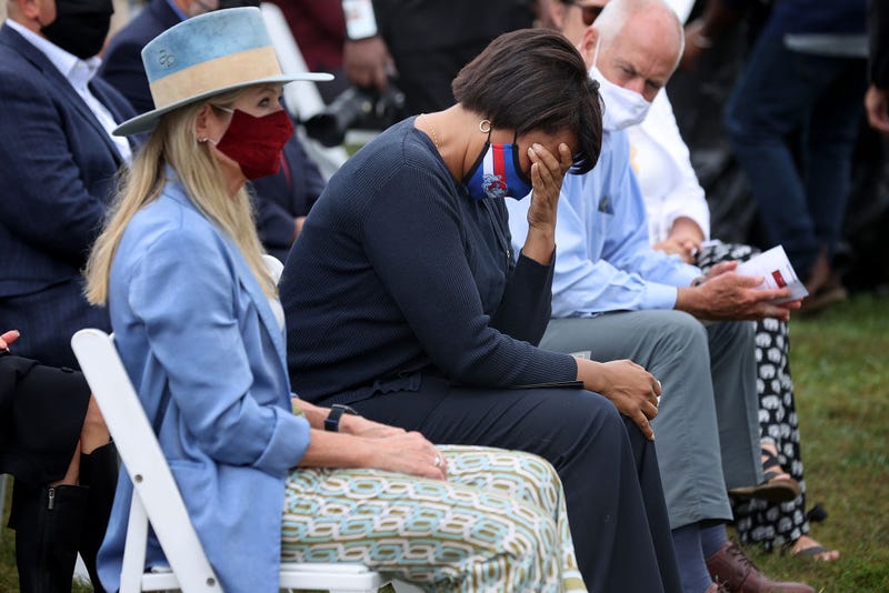 District of Columbia Mayor Muriel Bowser is overcome with emotion during the opening ceremony of 'In America: Remember,' a public art installation commemorating all the Americans who have died due to COVID-19 near the Washington Monument on September 17, 2021 in Washington, DC.