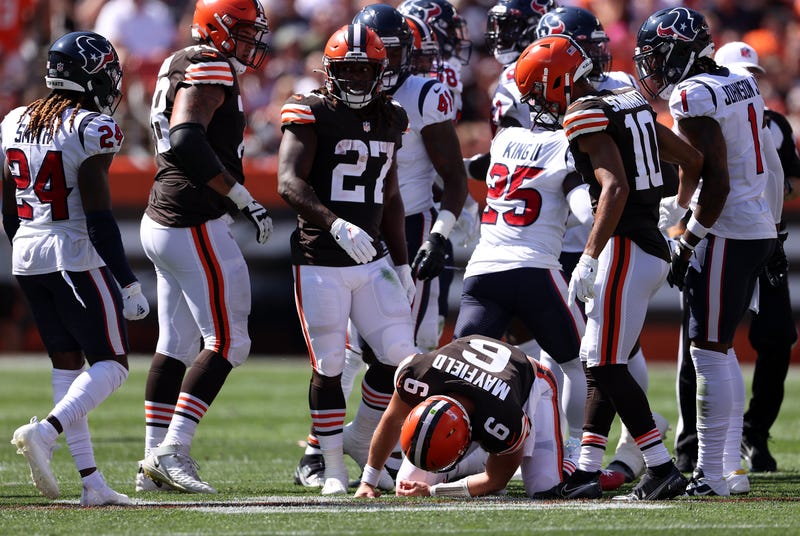 Quarterback Baker Mayfield #6 of the Cleveland Browns is on the ground after being hit in the first half in the game against the Houston Texans at FirstEnergy Stadium on September 19, 2021 in Cleveland, Ohio