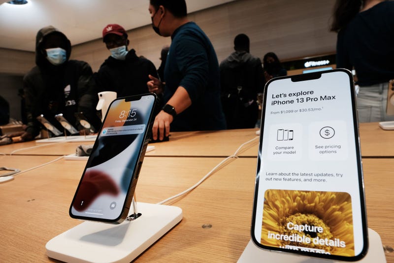 People shop at the Fifth Avenue Apple Store during the launch of Apple’s new iPhone 13 and iPhone 13 Mini on September 24, 2021 in New York City. The new phones come equipped with a A15 Bionic chip, improved dual-camera system and longer battery life than the iPhone 12. The iPhone 13 Mini starts at $729, and the iPhone 13 starts at $829. (Photo by Spencer Platt/Getty Images)