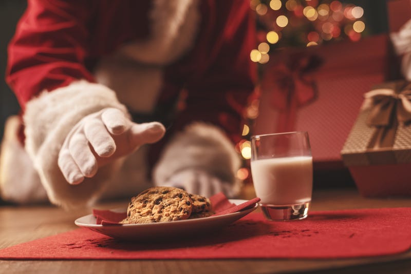 Santa Claus eating cookies.