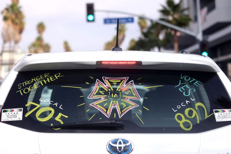 A driver displays their support for the IATSE union.