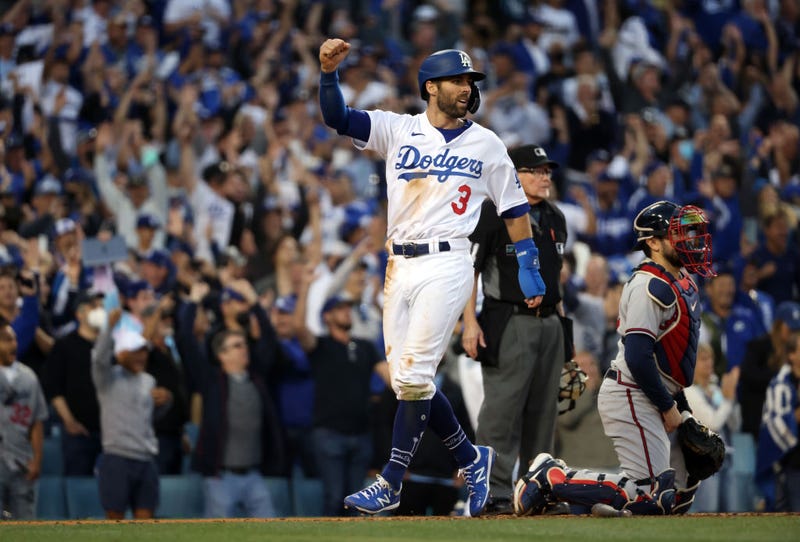 Chris Taylor #3 of the Los Angeles Dodgers score on a double by Mookie Betts #50 during the 8th inning of Game 3 of the National League Championship Series against the Atlanta Braves at Dodger Stadium.
