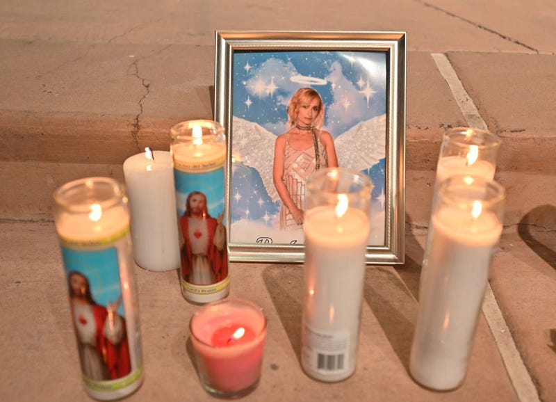 Candles are placed around a photo of cinematographer Halyna Hutchins during a vigil held in her honor at Albuquerque Civic Plaza on October 23, 2021 in Albuquerque, New Mexico. Hutchins was killed on set while filming the movie "Rust" at Bonanza Creek Ranch near Santa Fe, New Mexico on October 21, 2021. The film's star and producer Alec Baldwin discharged a prop firearm that hit Hutchins and director Joel Souza. (Photo by Sam Wasson/Getty Images)