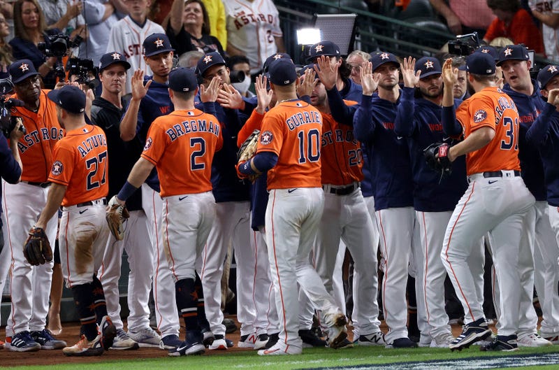 The Houston Astros celebrate the team's 7-2 win against the Atlanta Braves in Game Two of the World Series at Minute Maid Park on October 27, 2021 in Houston, Texas.