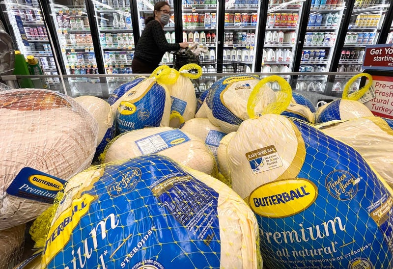 A shopper walks past turkeys for sale in a grocery store ahead of the Thanksgiving holiday on November 11, 2021 in Los Angeles, California.