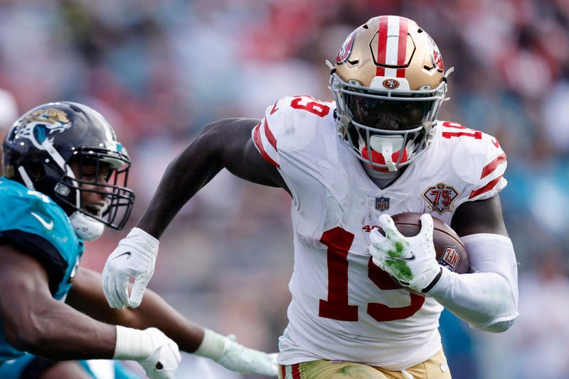 Deebo Samuel #19 of the San Francisco 49ers runs the ball during the second half against the Jacksonville Jaguars at TIAA Bank Field on November 21, 2021 in Jacksonville, Florida.