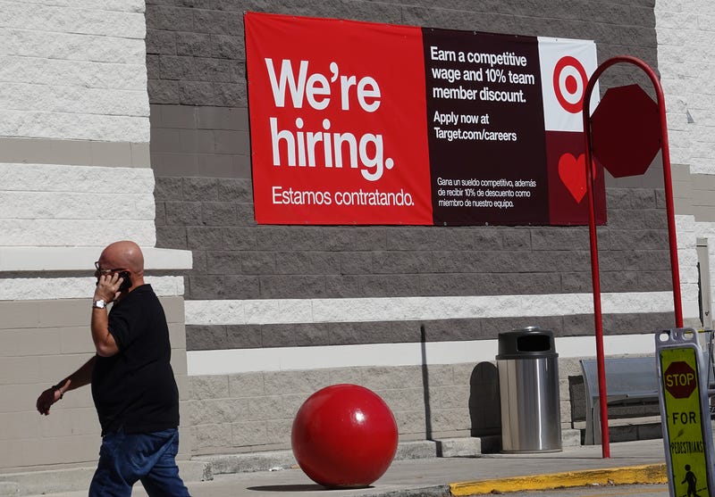 MIAMI, FLORIDA - DECEMBER 03: A We're hiring sign hangs on the wall of a Target store on December 03, 2021 in Miami, Florida. The Labor Department announced that payrolls increased by just 210,000 for November, which is below what economists expected, though the unemployment rate fell to 4.2% from 4.6%.
