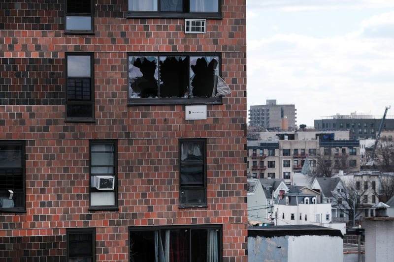 The Bronx apartment building stands a day after a fire swept through the complex killing at least 17 people and injuring dozens of others, many of them seriously on January 10, 2022 in New York City. The five-alarm NYC fire began around 11 am Sunday when a space heater caught fire inside of a duplex apartment on the 2nd and 3rd floors of the 19-story apartment building.