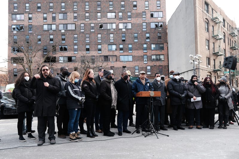Mayor Eric Adams is joined by clergy members, local politicians and others as he speaks to the media in front of a Bronx apartment building a day after a fire swept through the complex killing at least 17 people and injuring dozens of others, many of them seriously on Jan. 10, 2022