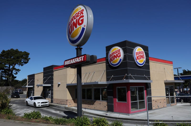 A car goes through the drive-thru a a Burger King restaurant on February 15, 2022 in Daly City, California. Restaurant Brands International, the parent company of Burger King, reported strong fourth quarter earnings that beat analyst expectations with revenue of $1.55 billion.