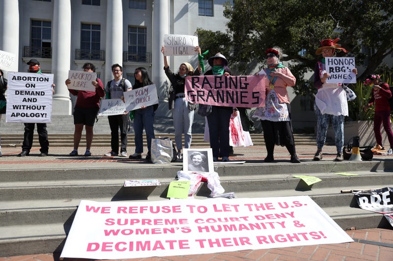 Demonstrators hold signs as they stage a protest in favor of abortion rights on the steps of Sproul Hall on the UC Berkeley campus on March 08, 2022 in Berkeley, California.